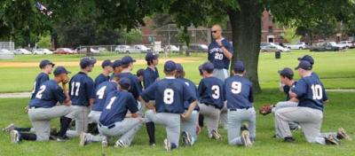 Champs seek to repeat: Boston Collegiate Charter School baseball coach Matt Underhill gives the Hurricanes a pep talk before the Charter School State Championship semi-finals on Monday at Joe Moakley Park.  Photo by Elizabeth Murray