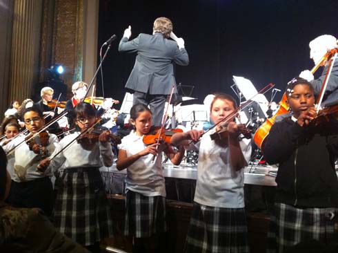 Dorchester Christmas Celebration: Steve Lipsitt and the Boston Classical Orchestra with the Pope John Paul II Catholic Academy strings ensemble. Photo by Bill Forry