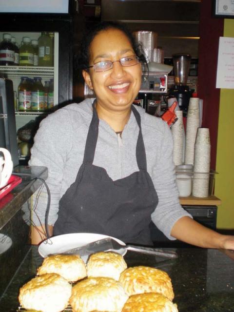 Dot2Dot: Karen Henry Garrett with some of her homemade bread at Dot2Dot Cafe. 	   Photo by Sue Asci