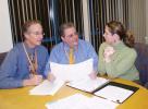 Joel Abrams, center, president and CEO of Dorchester House, discusses his centerâ€™s successful stimulus funding proposal with Director of Development Jessica Loew, right, and Ira Schlosser, Director of Planning and Community Affairs.