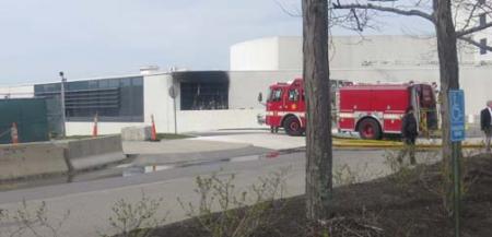 Probe continues into Monday fire: Another view of the damage to the JFK Library. Photo by Bill Forry