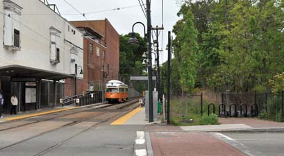 Neponset Greenway: The Mattapan trolley stop at Central Ave, left. A proposed Greenway path would follow a route closer to the river, at right.  Photo by Ed Forry