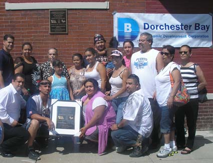 Serrano ceremony: Family of Geraldo Serrano gather around a plaque in his honor last Saturday.