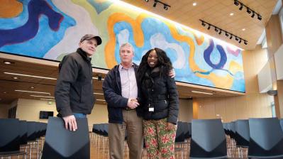 Clarita Stephens shaking hands with City of Boston Property and Construction Management Department senior project manager, Tom Leahy (OFD); James Hobin, at left.  	Mark Millstein photo