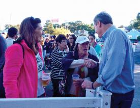Baker: Charlie Baker shakes hands with supporters in the beer garden at the Irish Heritage Festival on Sunday afternoon. 	Photo by Lauren Dezenski