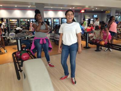 Craira Davis, left, and Adezna Ventura shared a laugh at BCYF’s Girls Night event at Boston Bowl on Tuesday. In all, 105 girls participated. 	Lauren Dezenski photo