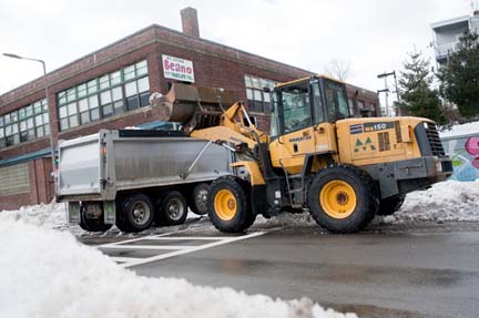 Snow removal in Uphams Corner: City workers clearing the way on Columbia Rd.