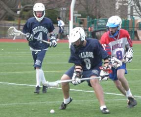 Bulldogs lacrosse, April 4, 2009: The Bulldogs fell to Brookline in their fourth outing of the '09 campaign. Above, Charlie Marshall and Kristian Kirleis fight for a loose ball.