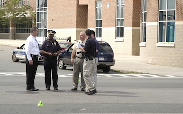 Shooting outside Lilla Frederick School: Investigators on the scene at Columbia Rd. and Wyola Place. Photo by Bill Forry