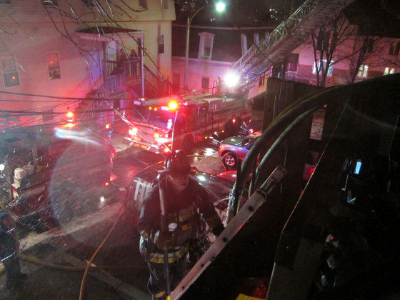 Firefighter at work on Everett Ave. Photo by Boston Fire Department