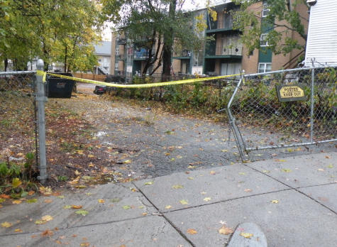 Shooting scene: Dorchester resident Lloyd  > Payne's vehicle plowed through a fence on Bullard Street following the fatal midday shooting on Thursday.