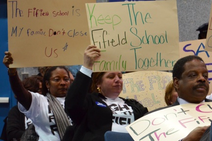 Fifield Parents Object to Closing: BPS Superintendent Carol Johnson's plan to close the school prompted these signs of protest at a Wednesday meeting in Jamaica Plain. Photo by Chris Lovett