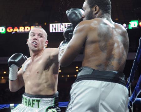 Still undefeated: Billy Traft lands one of his many punches on the face of Joe Powers on Saturday night at TD Garden. Photo by Emily Harney