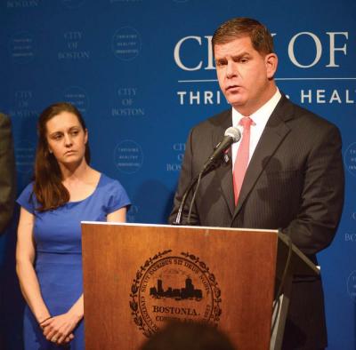 Mayor Martin Walsh convened a press conference on Monday to announce he would not sign a taxpayer guarantee for the proposed Boston 2024 Games without seeing the text of the agreement first. At left, he is joined by Sara Myerson, executive director of the Office of Olympic Planning.           	                                             Photo courtesy Mayor Walsh’s press office.