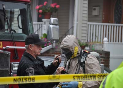 HazMat crew on Semont Rd.: Boston Firefighters spent the morning investigating an "irritant" found in the air inside 14 Semont Rd. Photo by Ed Forry