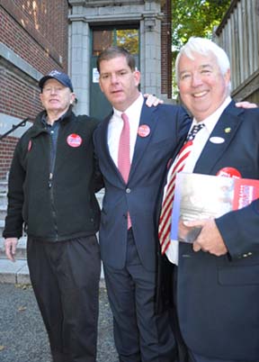 Walsh in his home base: The candidate with two key Savin Hill supporters working the polls outside Cristo Rey School. Left, Danny Ryan. Right, Roger Croke. Photo by Bill Forry