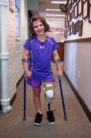 Jane Richard: Dorchester girl, 7, tried out her new prosthetic leg at the United headquarters on Columbia Rd. Photo courtesy Richard family