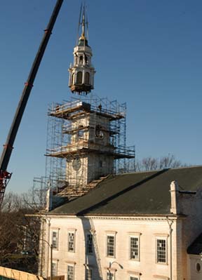 First Parish steeple comes off in 2006: The church has undergone extensive renovations since this photo was taken. On Tuesday, the rebuilt steeple is scheduled to be craned back into place. Photo by Bill Forry