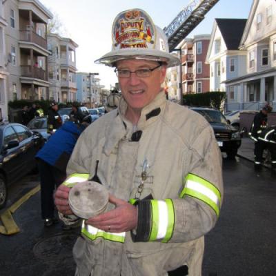 BFD Deputy Chief Jay Fleming holds one of the smoke detectors that activated.