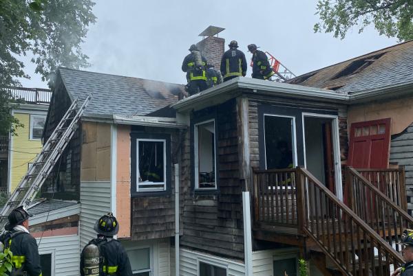 Firefighters at 115 Adams Street fire