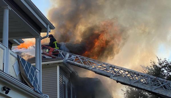 Firefighters at three-alarm fire on Floyd St.