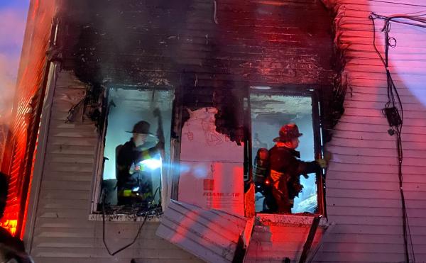 Firefighters inside Corona Street three decker