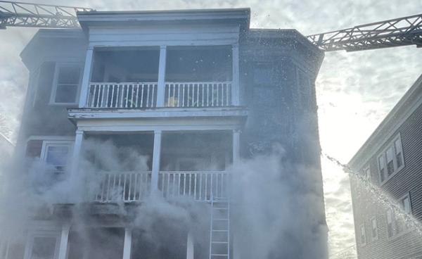 Mora Street three decker during fire