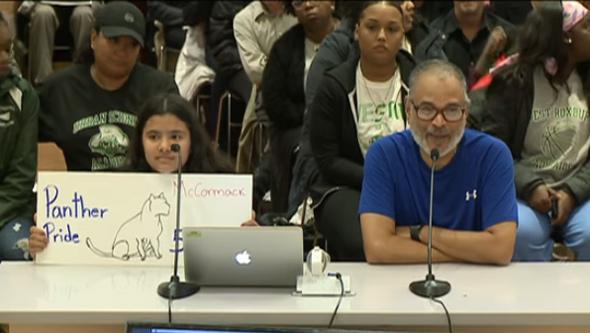 Student shows Panther Pride while addressing the School Committee