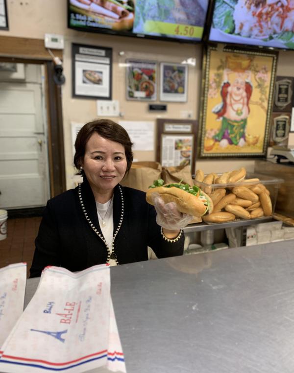 Jennifer Nguyen with Ba Le's signature banh mi. Reporter file photo by Dan Sheehan
