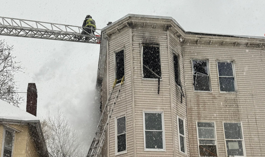 Firefighters on or near roof of 26 Wentworth St. Photo by Boston Fire Department